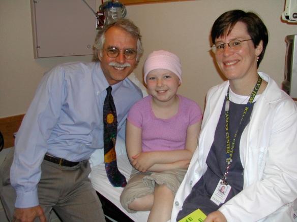 Emma, 8 years old with Dr. Weinstein and Patricia.  